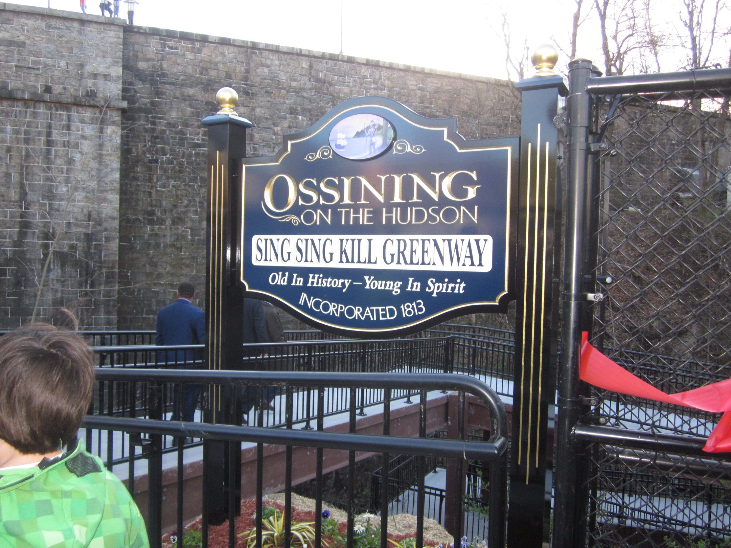 Sign at east end, near community center